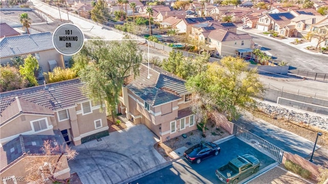 birds eye view of property with a residential view