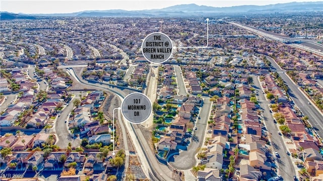 birds eye view of property with a mountain view and a residential view