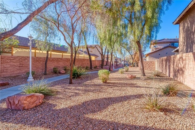 view of yard with fence