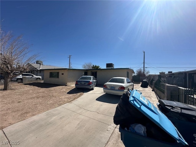 view of front of property featuring fence