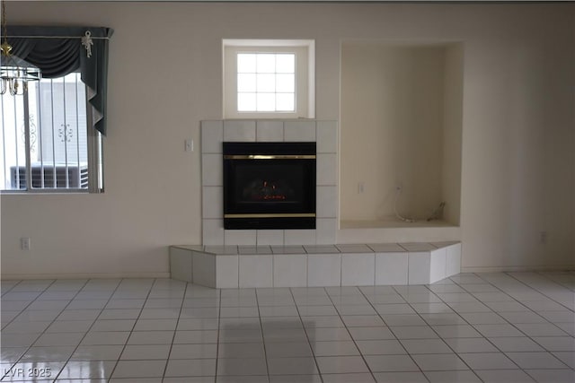 room details featuring a tile fireplace