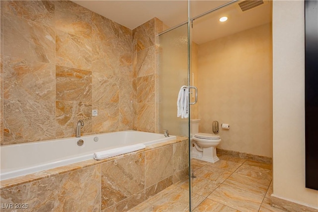 bathroom with visible vents, toilet, a shower with door, a relaxing tiled tub, and baseboards