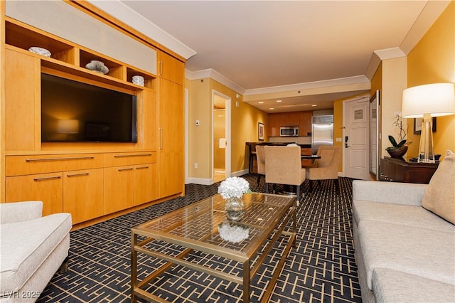 living room featuring baseboards and ornamental molding