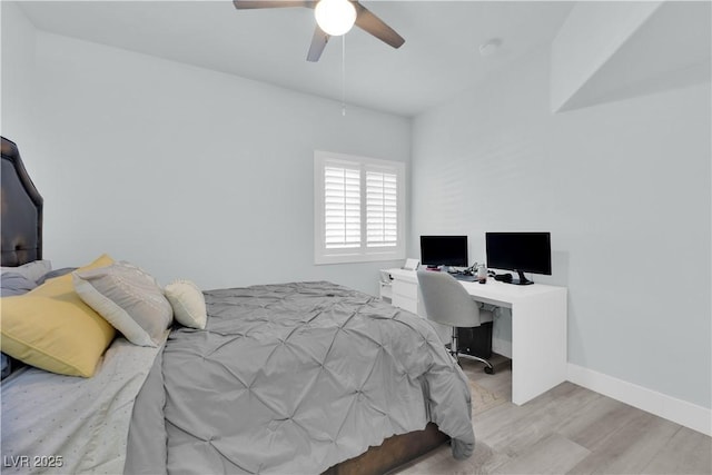 bedroom with baseboards, wood finished floors, and a ceiling fan