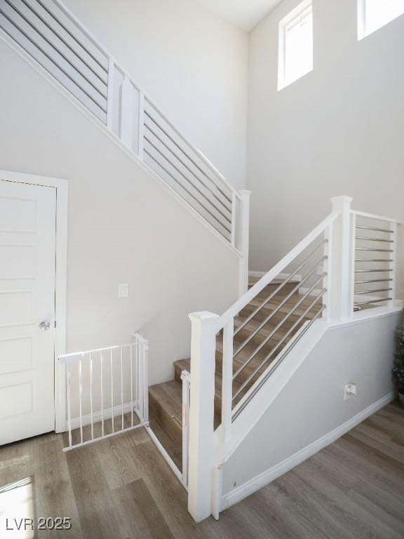 stairs with wood finished floors