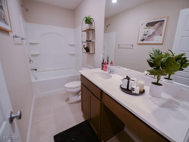 bathroom with vanity, tile patterned floors, toilet, and tub / shower combination