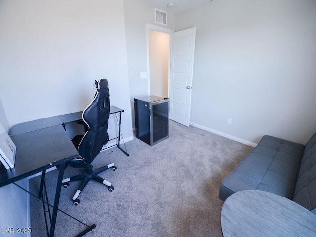 office area featuring carpet, visible vents, and baseboards