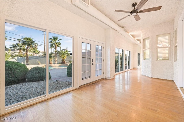 unfurnished sunroom featuring french doors