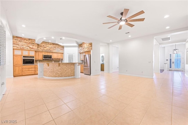 unfurnished living room featuring light tile patterned floors, ceiling fan, and recessed lighting