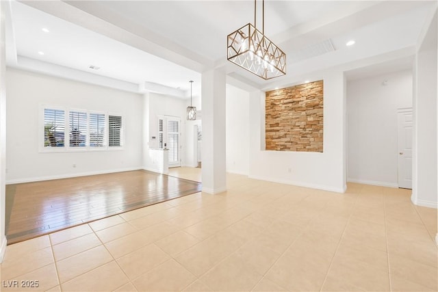 interior space with a chandelier, light tile patterned floors, a wealth of natural light, and recessed lighting
