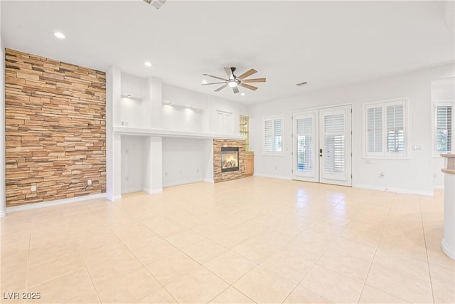 unfurnished living room with light tile patterned floors, a fireplace, a ceiling fan, and recessed lighting