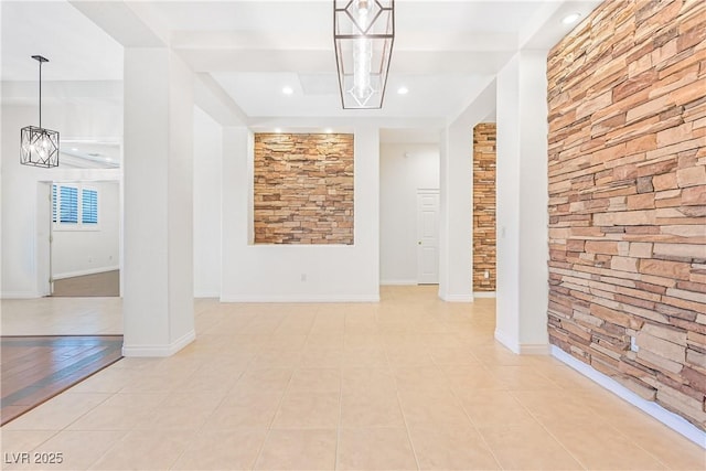 interior space with recessed lighting, light tile patterned floors, baseboards, and an inviting chandelier