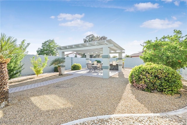 rear view of house featuring a fenced backyard, a patio, and a pergola