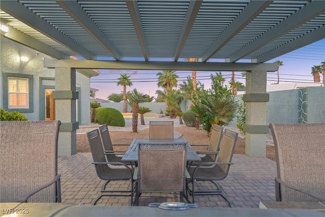 view of patio / terrace featuring outdoor dining space, a pergola, and a fenced backyard