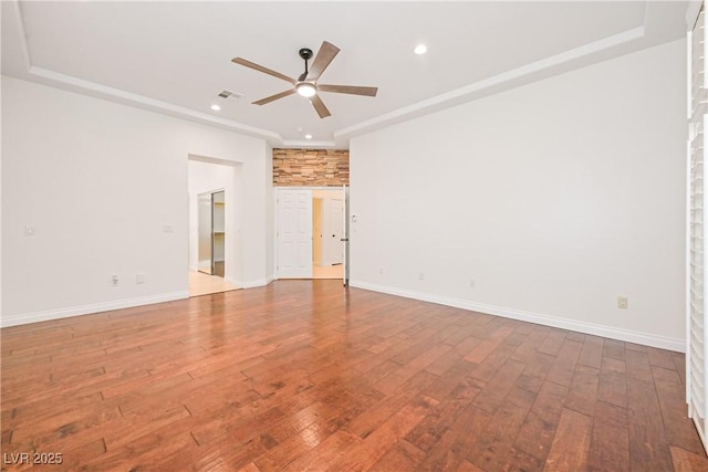 empty room with recessed lighting, wood-type flooring, visible vents, and a ceiling fan