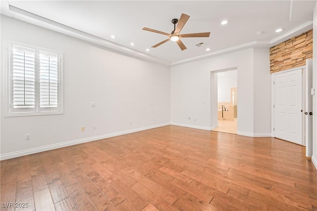 empty room featuring light wood-style flooring, ceiling fan, baseboards, and recessed lighting