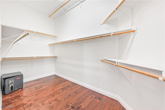 spacious closet featuring hardwood / wood-style floors