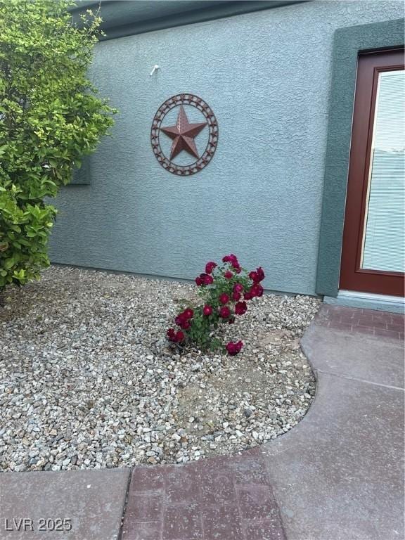 exterior details featuring stucco siding