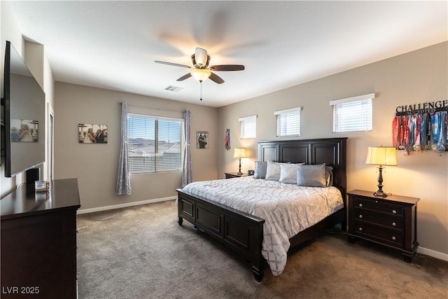 bedroom with baseboards, visible vents, dark carpet, and ceiling fan