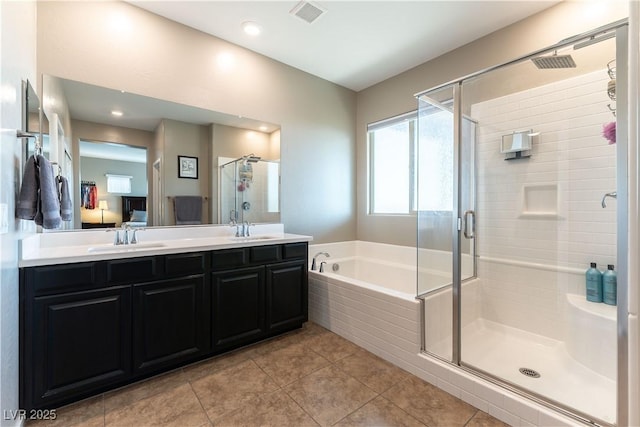 full bathroom featuring a bath, visible vents, a shower stall, and a sink