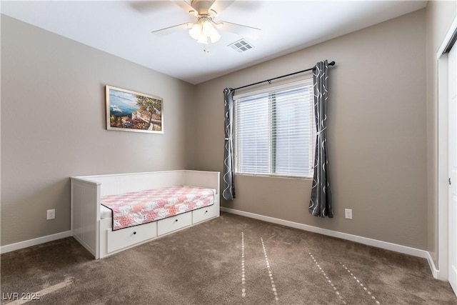 unfurnished bedroom with carpet, baseboards, visible vents, and ceiling fan