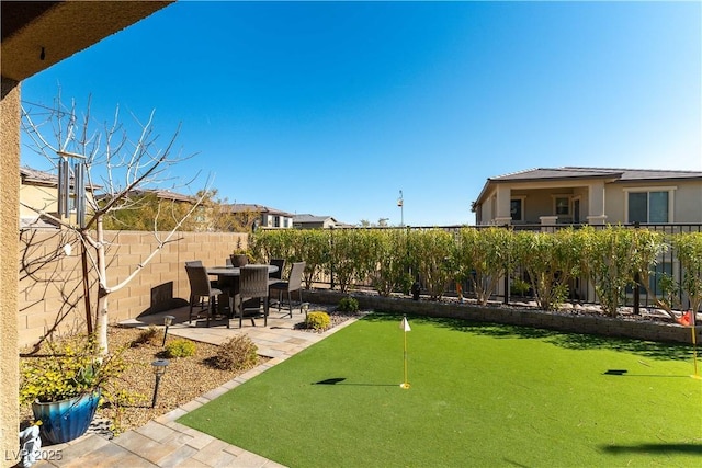 exterior space featuring a fenced backyard and a patio