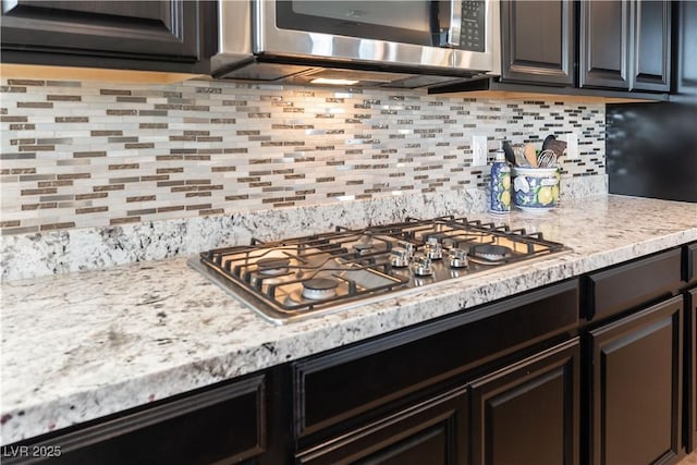 kitchen featuring backsplash and appliances with stainless steel finishes