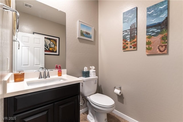 bathroom featuring vanity, toilet, baseboards, and visible vents