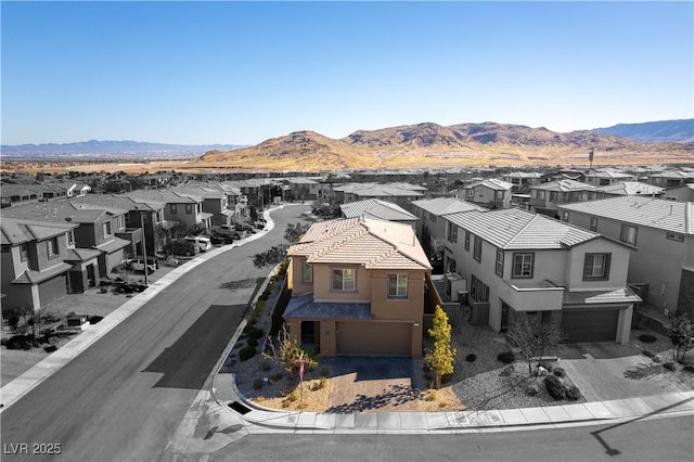 birds eye view of property featuring a residential view and a mountain view