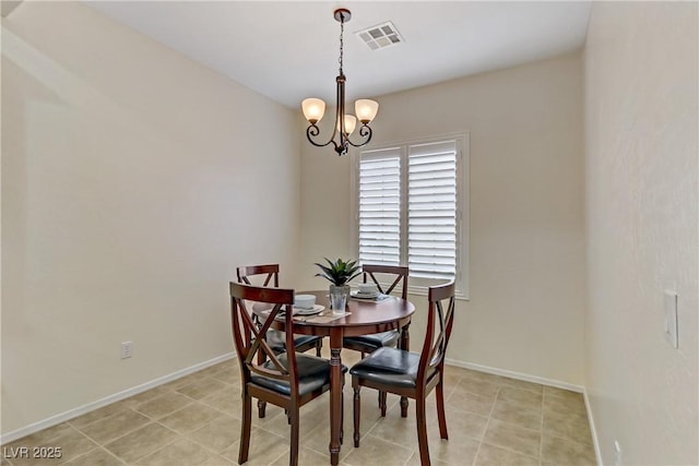 dining room featuring a chandelier, visible vents, baseboards, and light tile patterned floors