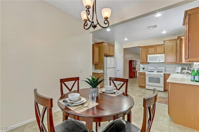 dining area featuring baseboards, recessed lighting, visible vents, and a chandelier