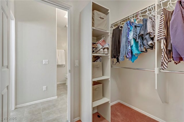 spacious closet featuring tile patterned floors