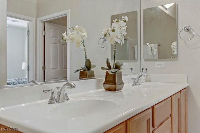 full bath with double vanity and a sink