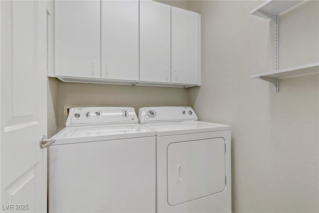 clothes washing area with cabinet space and washing machine and clothes dryer