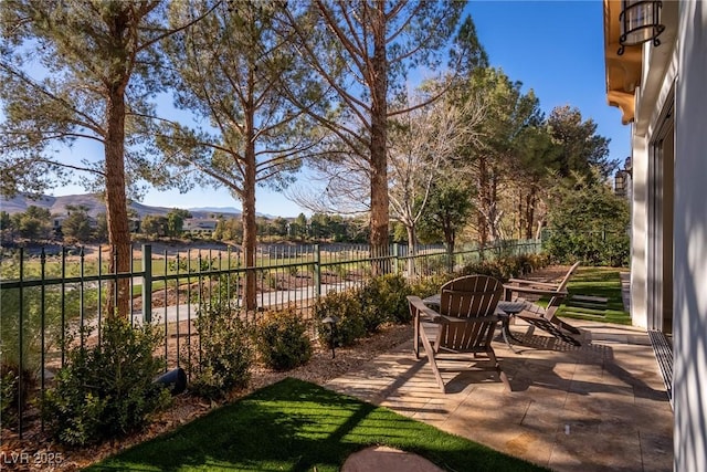 view of patio / terrace featuring fence