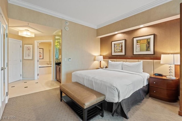 bedroom featuring connected bathroom, baseboards, and ornamental molding