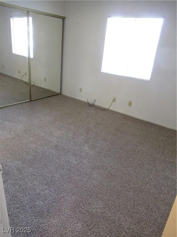 unfurnished bedroom with a closet