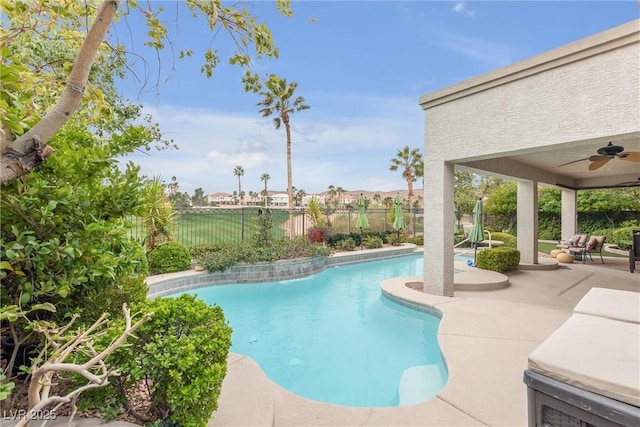 view of swimming pool featuring a fenced backyard, a patio, a fenced in pool, and ceiling fan