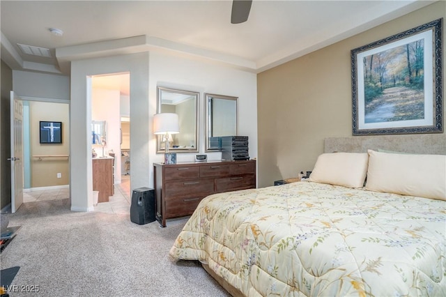 carpeted bedroom with visible vents and a ceiling fan