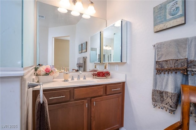 bathroom featuring vanity and an inviting chandelier