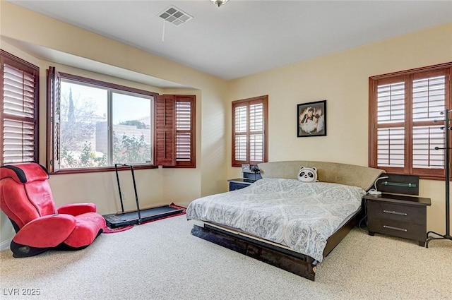 bedroom featuring visible vents and carpet flooring