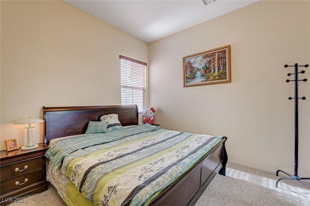 bedroom with visible vents, baseboards, and light colored carpet