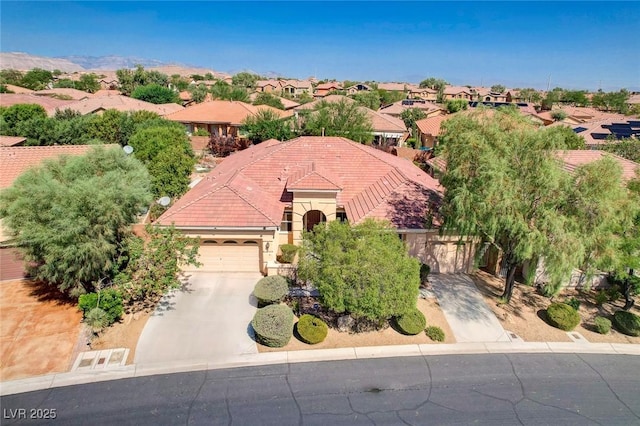 birds eye view of property with a residential view