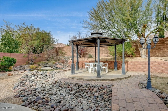 view of patio / terrace featuring a gazebo and a fenced backyard