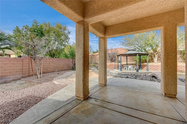 view of patio with a gazebo and a fenced backyard