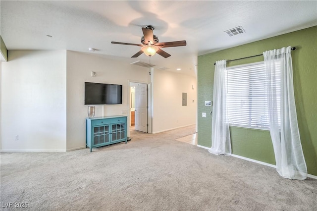 unfurnished living room featuring a ceiling fan, carpet, and visible vents