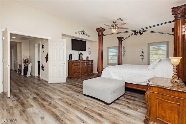 bedroom featuring light wood-style flooring, baseboards, and visible vents