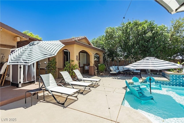 view of patio / terrace featuring an outdoor living space and an outdoor pool