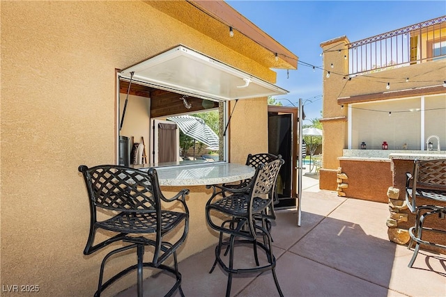 view of patio featuring outdoor dry bar