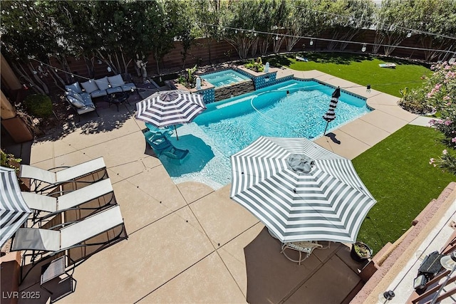 view of pool with a patio area, a fenced backyard, and a pool with connected hot tub